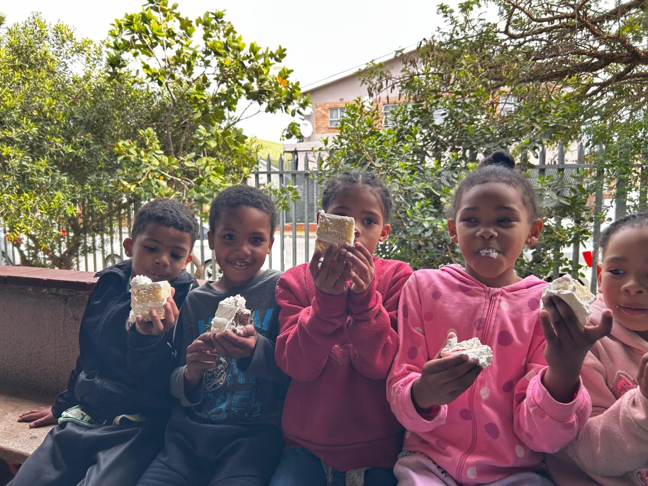 Kiddies enjoying some cake on St. Dominics Day
